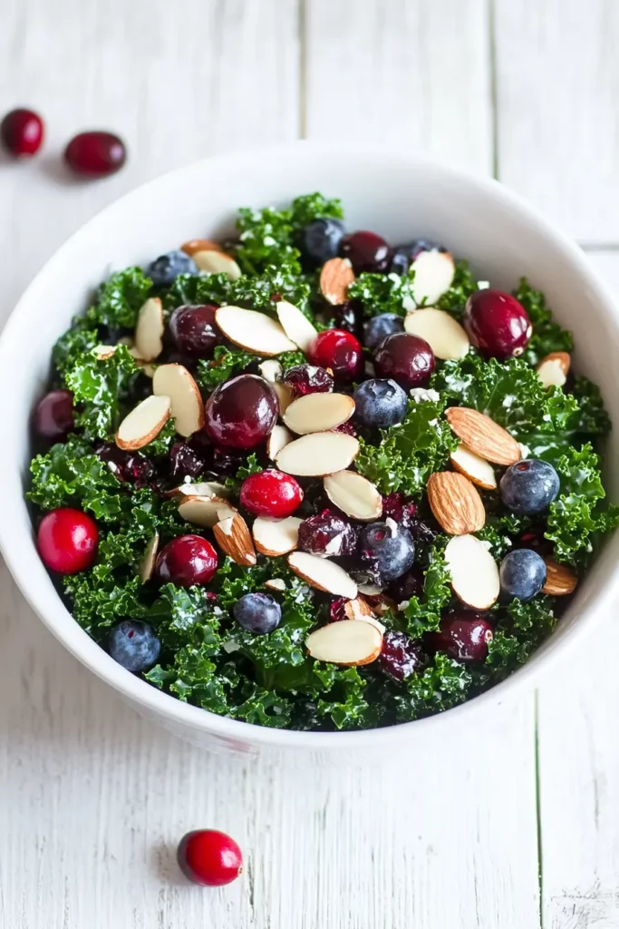 Close-up of kale salad with cranberries and almonds.