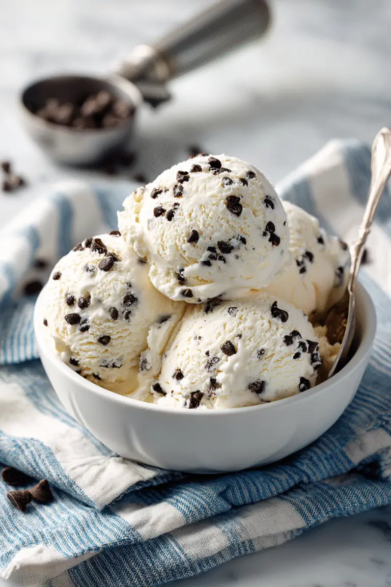 Creamy cottage cheese ice cream scoops with chocolate chips served in a bowl, smooth and refreshing treat