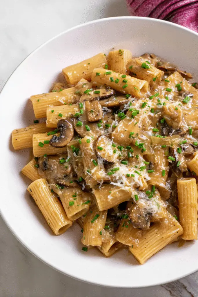 French Onion Pasta Soup, creamy rigatoni pasta tossed in a rich caramelized onion and mushroom sauce