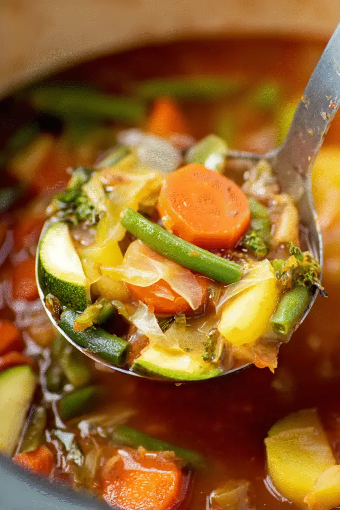 Hearty Weight Watchers cabbage soup with carrots, zucchini, green beans, and rich tomato broth for a cozy meal