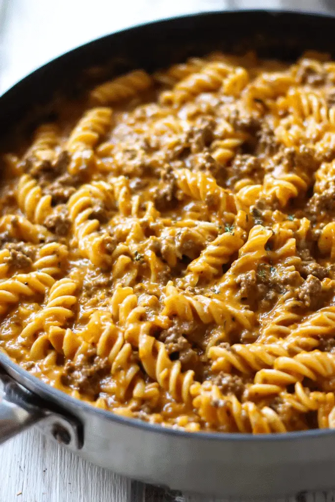 Creamy stovetop ground beef pasta with rotini noodles coated in rich cheesy sauce for a cozy and hearty dinner.