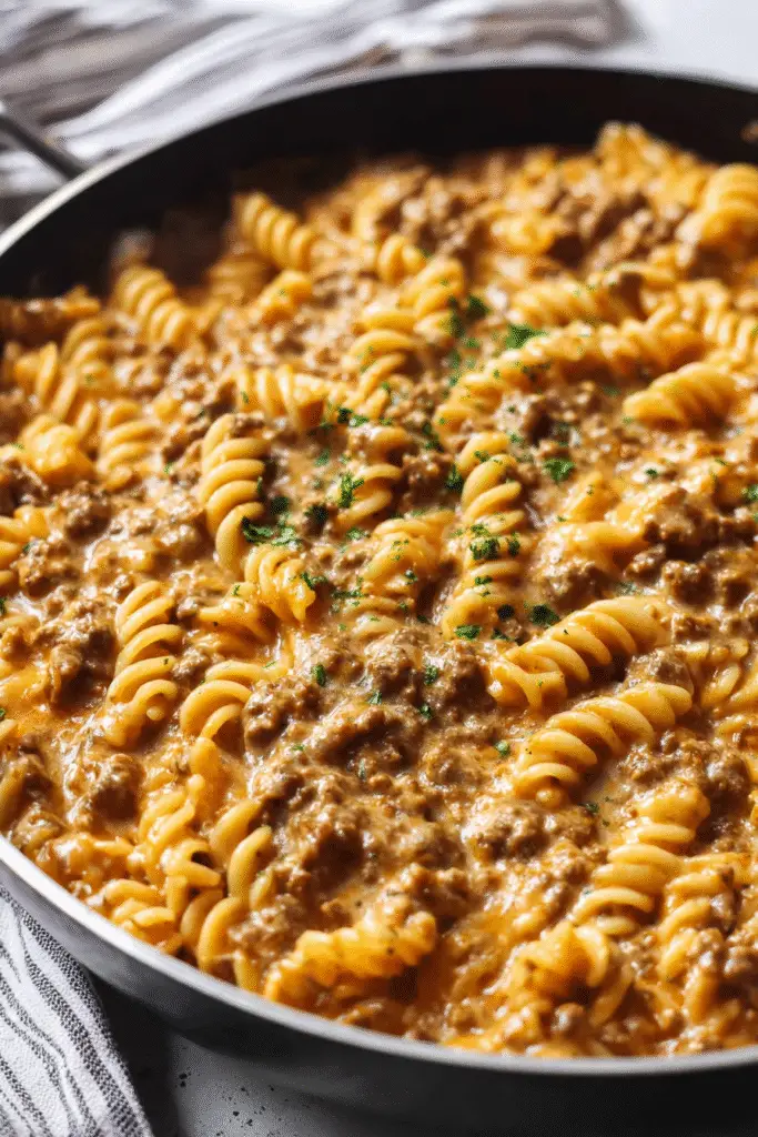Creamy stovetop ground beef pasta with rotini noodles coated in rich cheesy sauce for a cozy and hearty dinner.