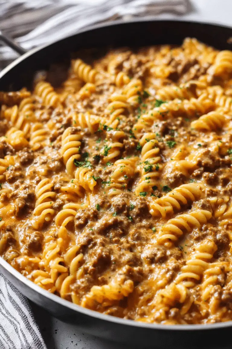 Creamy stovetop ground beef pasta with rotini noodles coated in rich cheesy sauce for a cozy and hearty dinner.